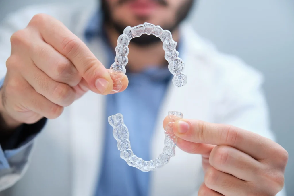 An orthodontist explains Invisalign clear braces vs. traditional braces like lingual braces.